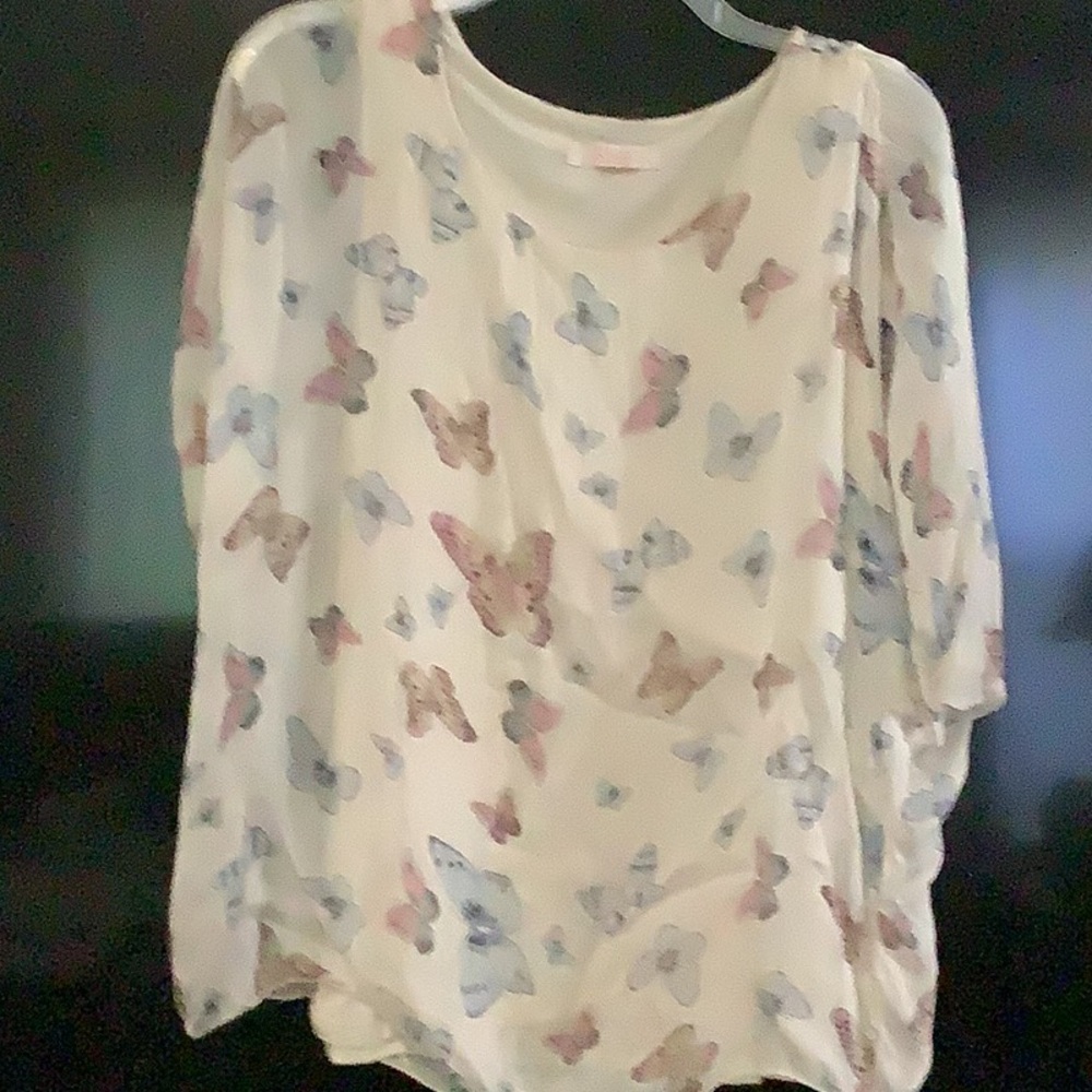 Blouse with sheer overlay